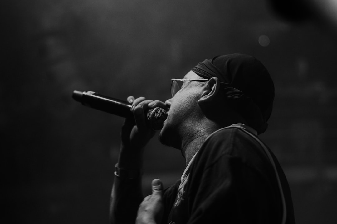 Rapper performing on stage with microphone