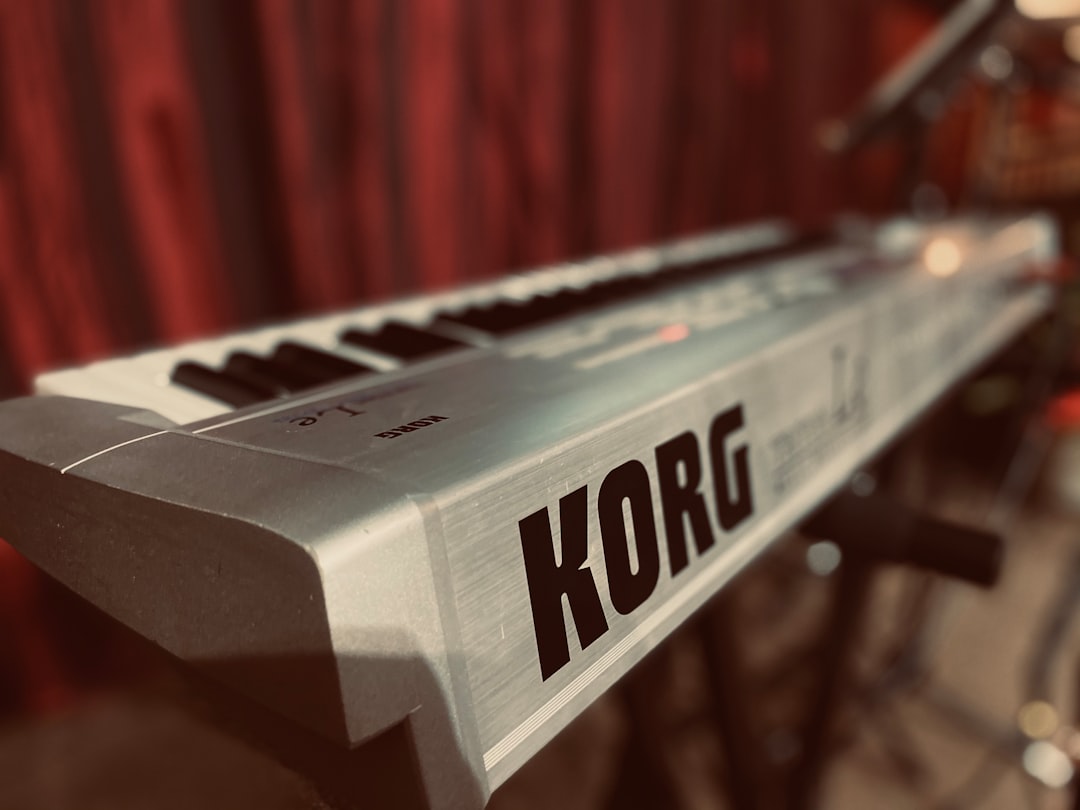 a close up of a keyboard with the word korg on it