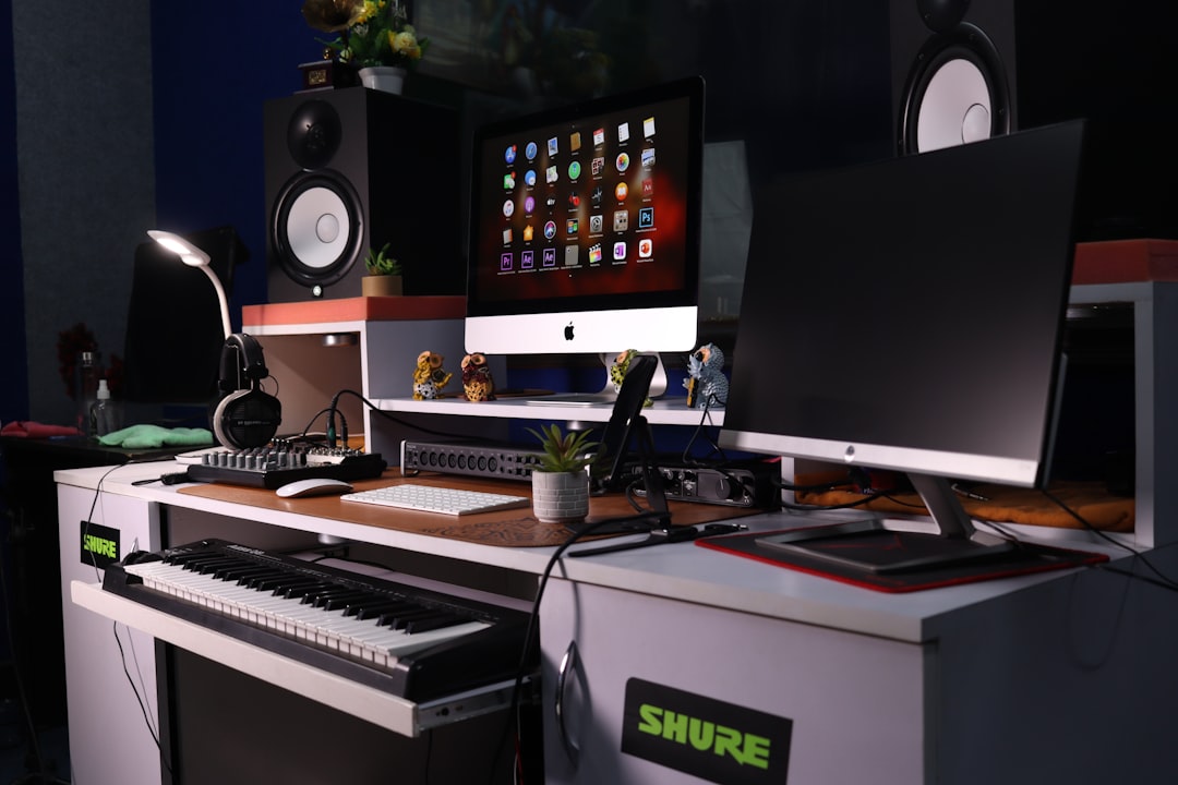 a computer desk with a keyboard and a monitor