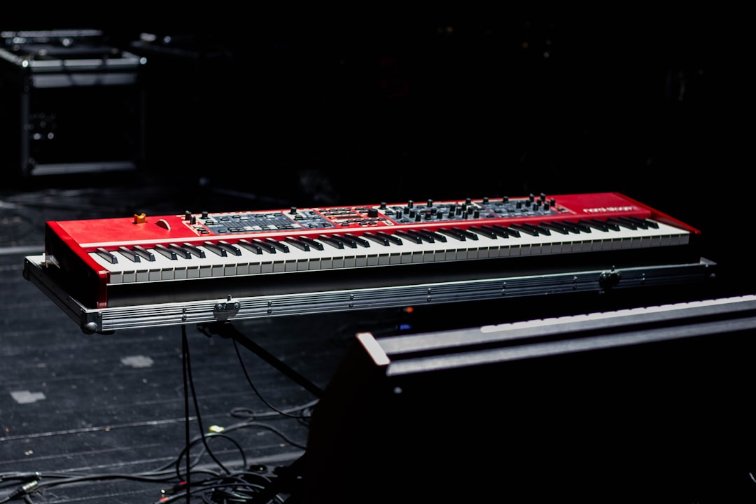 A red and white keyboard sitting on top of a stage