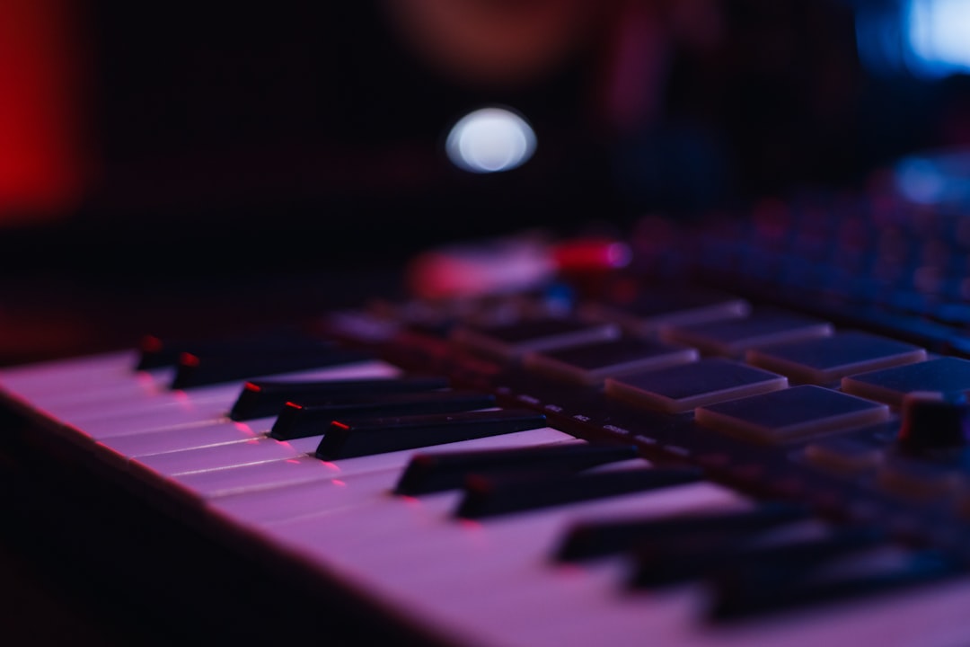 Close-up of a midi keyboard with purple lighting